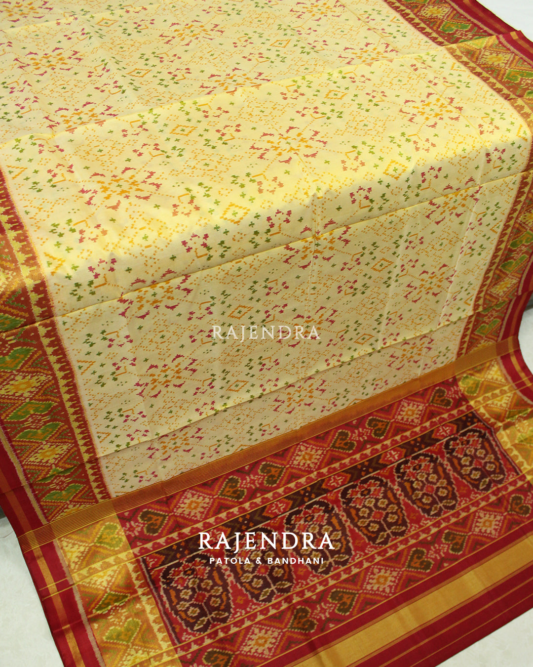 Traditional Navratna Bhat Red Off-White Single Ikat Rajkot Patola Saree
